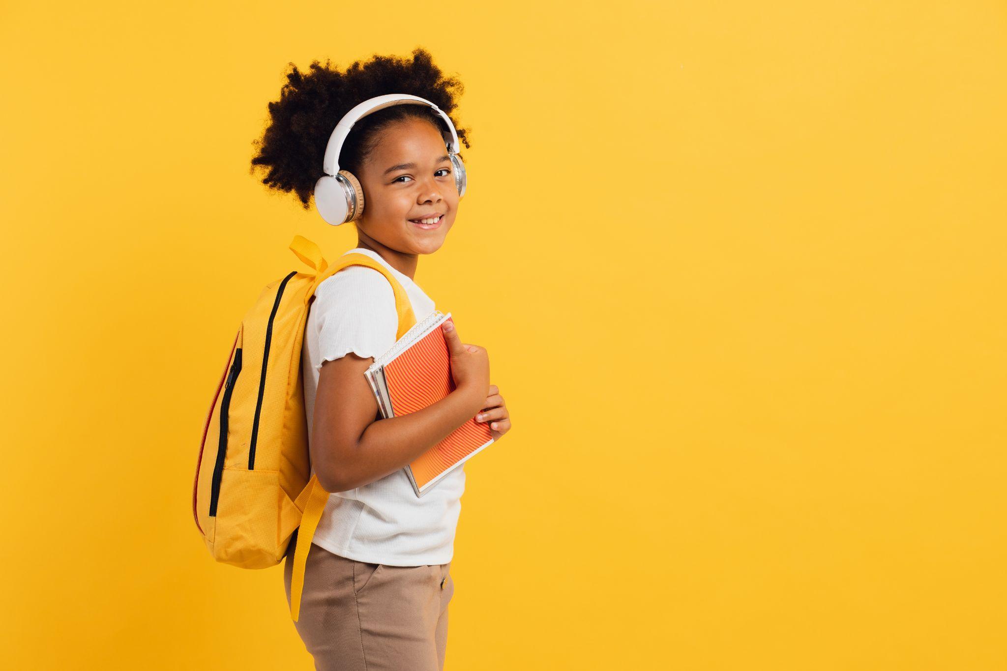 child wearing a school bag